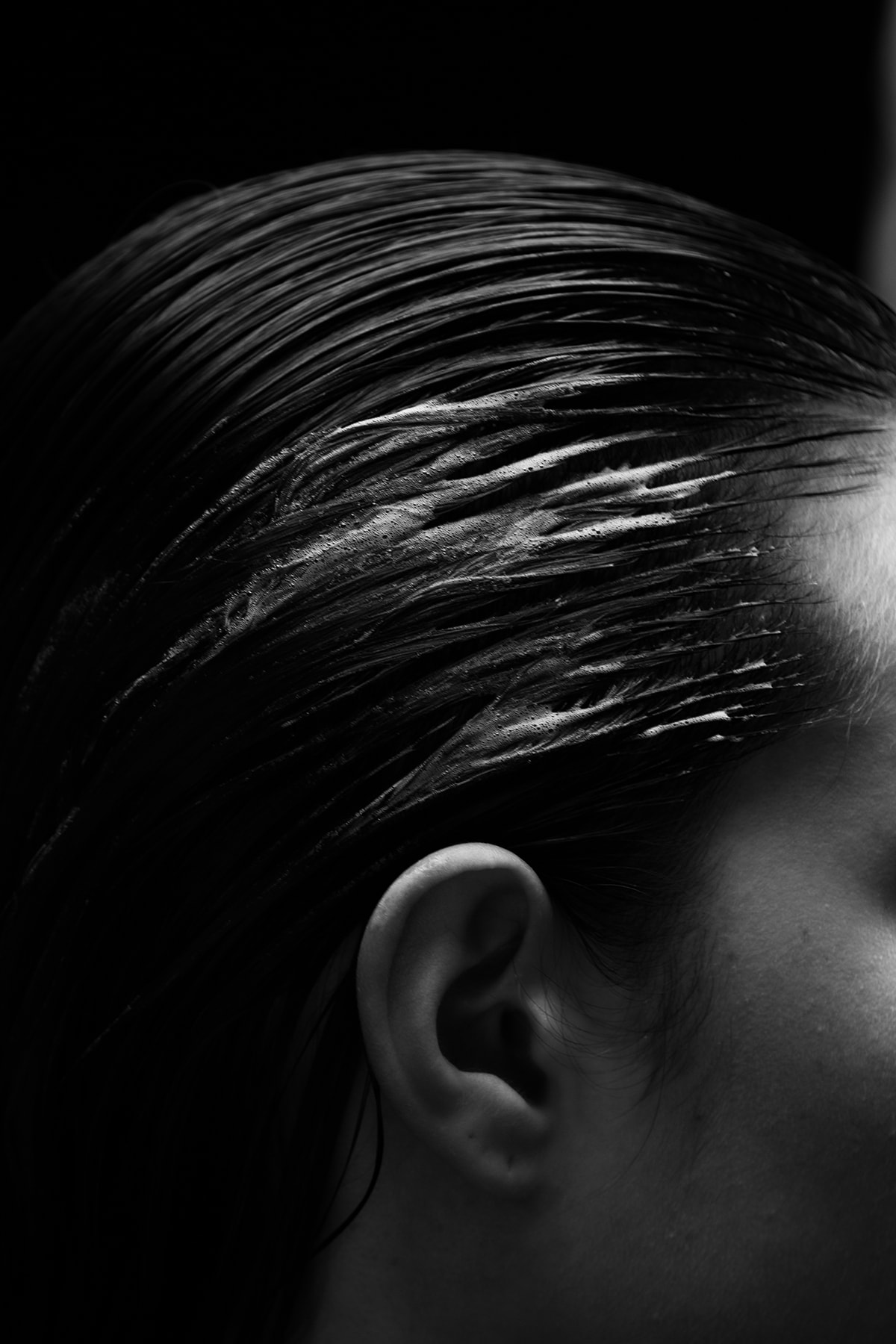 Hairdresser cutting hair at Salon Fiorella