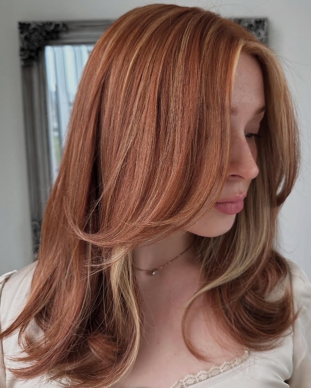 Rich brunette balayage with warm caramel highlights and voluminous curls — Salon Fiorella
