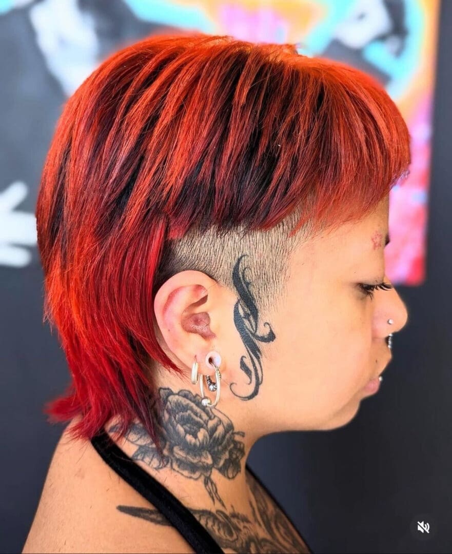 Vivid red mullet cut with shaved sides and intricate design — Salon Fiorella
