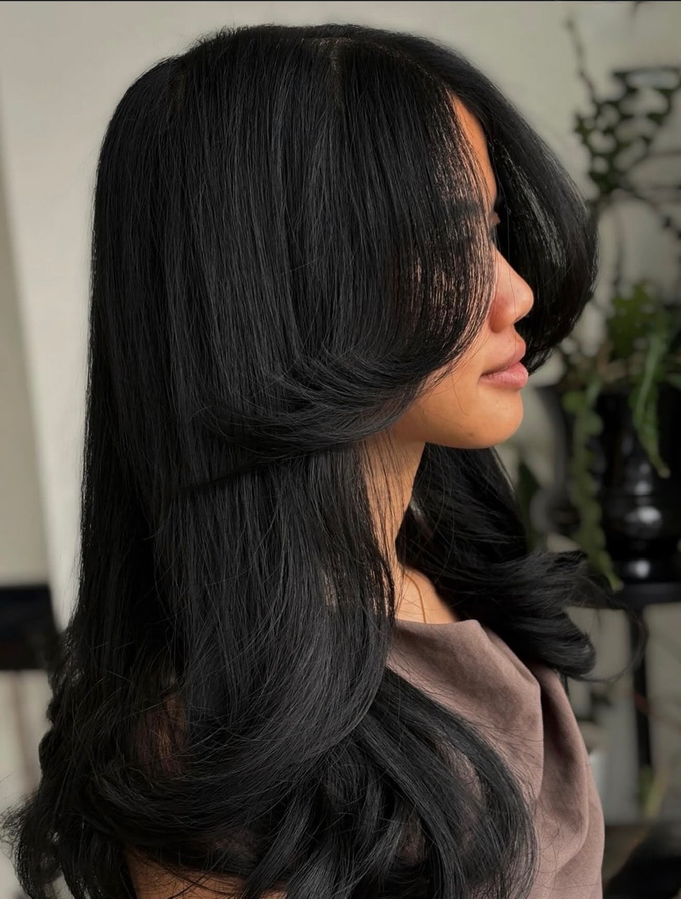 Dark burgundy balayage mid-length cut — Salon Fiorella